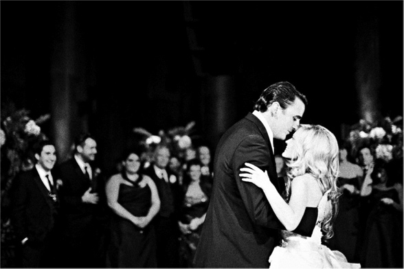 B/W Bride and Groom Dancing in Front of Crowd